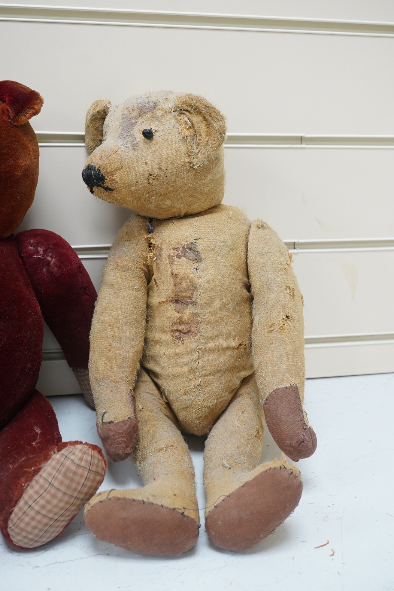 Three bears, one Chiltern 1950's. Condition - good, missing eyes, height 46cm, 1930's plush ear, button eyes. Condition - faded, height 42cm, 1930's bear, height 40cm. Condition - poor.